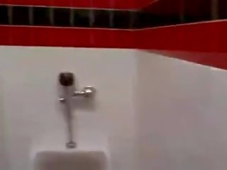 Cashier gives a random adolescent a public bathroom blowjob