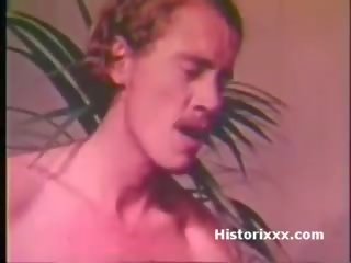 Busty diva sucks huge shaft and gets facial in vintage video